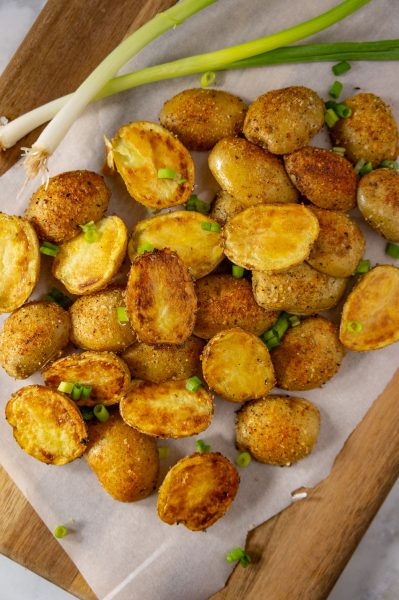platter of roasted potatoes with green onions