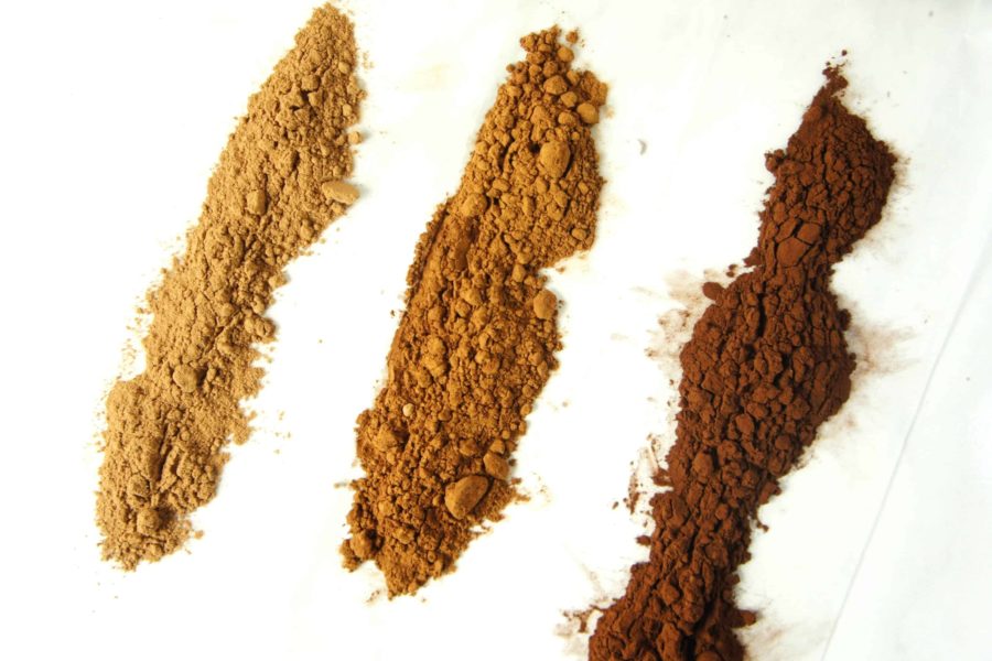 three lines of cocoa powder, from light brown to dark brown