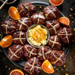 hot cross buns with orange slices and orange honey butter