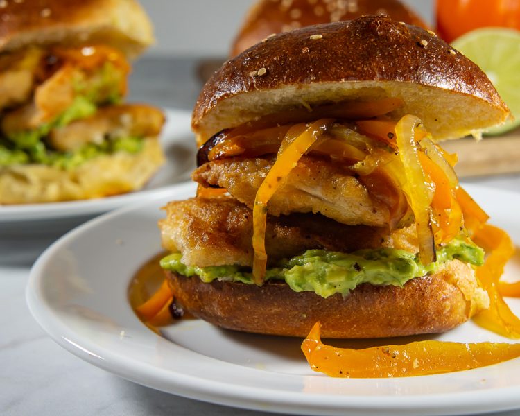 crispy chicken sandwich with avocado spread
