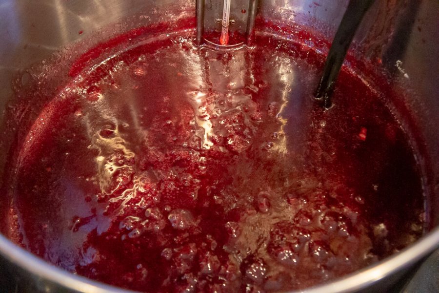 pot of bubbling pomegranate jelly