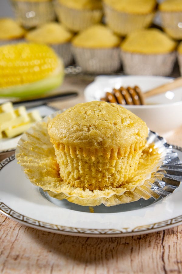 unwrapped cornbread muffin on a plate