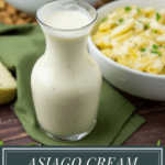 a glass carafe of white cheese sauce in front of a bowl of pasta