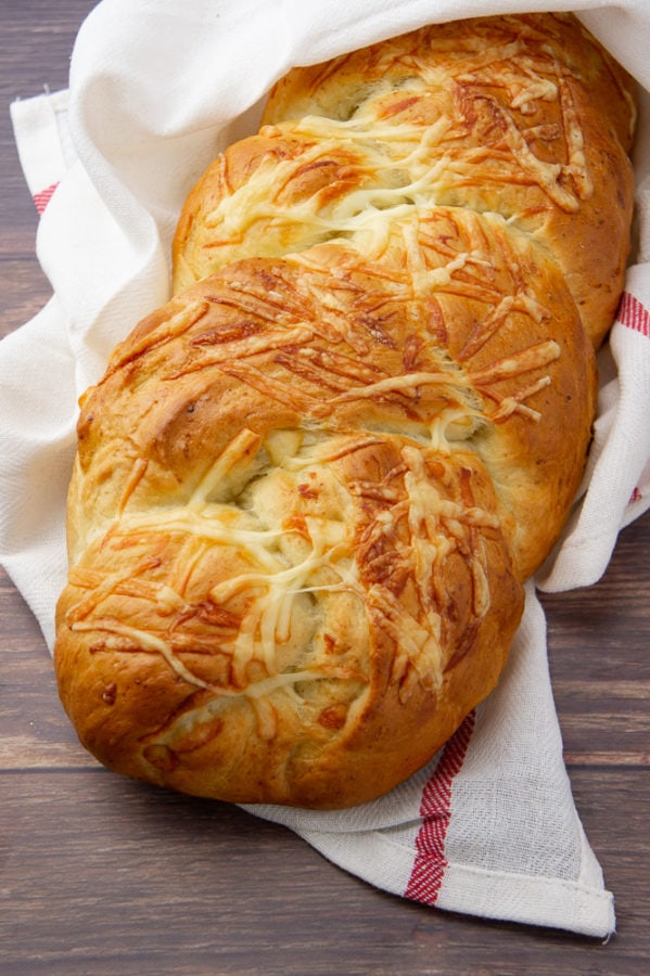 a loaf of braided Asiago cheese bread