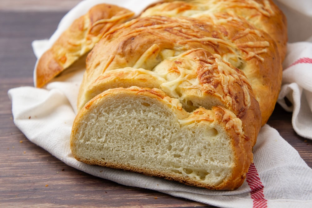 a sliced loaf of asiago bread