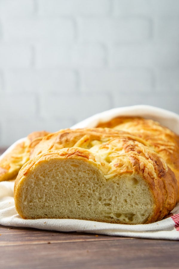 a loaf of sliced asiago bread