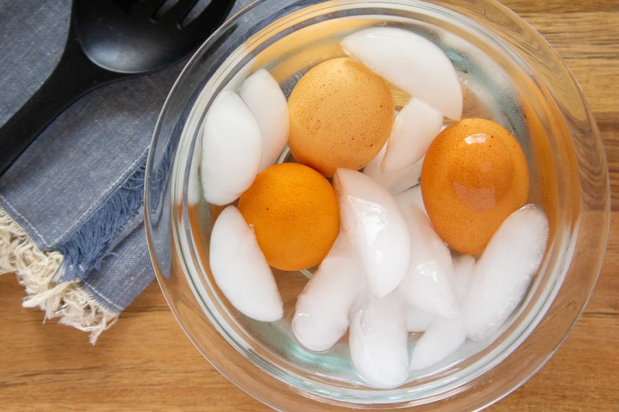 eggs sitting in a bowl of ice water
