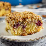 a slice of blackberry coffee cake on a plate.