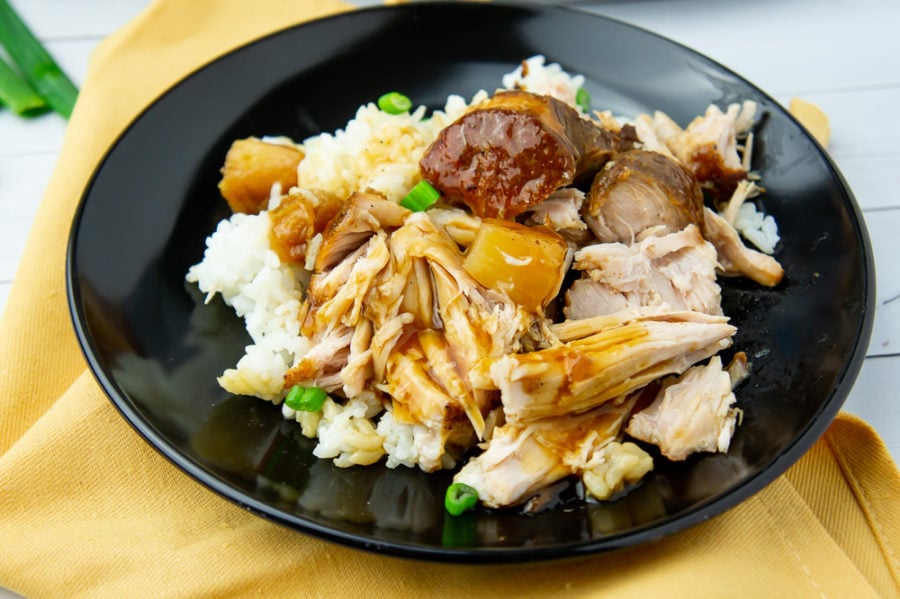 a plate of pineapple pulled pork with rice