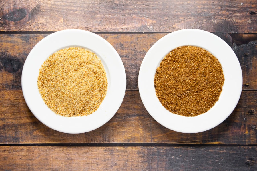 two white plates full of breadcrumbs