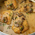 A big pot of chicken in a creamy mushroom marsala sauce
