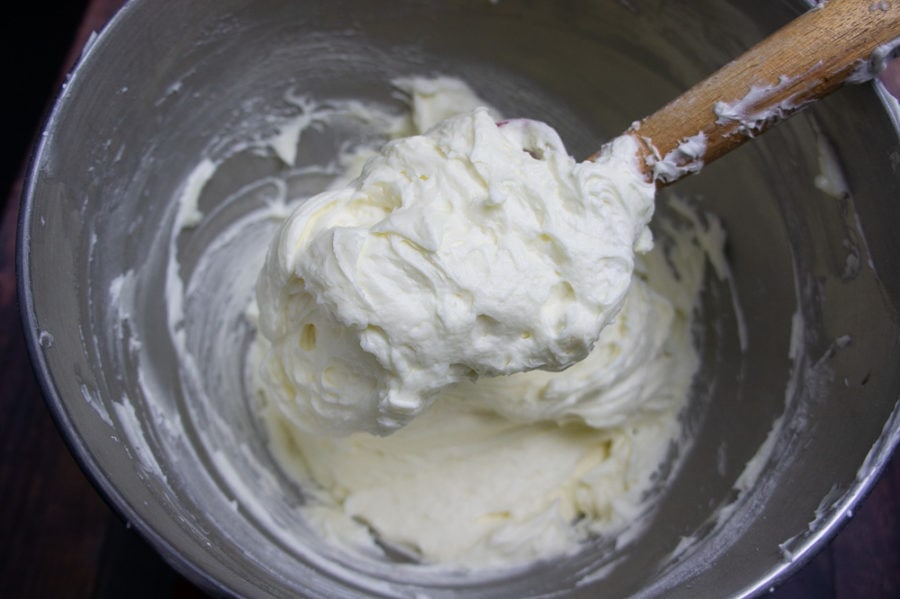 finished mascarpone frosting in  large metal bowl