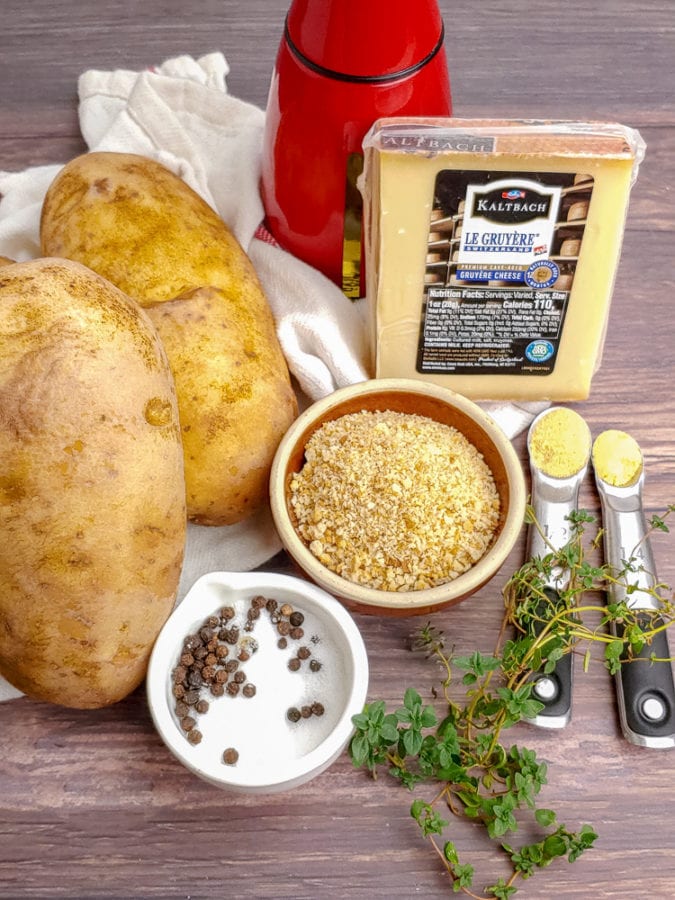 large russet potatoes, breadcrumbs, salt, pepper, thyme, mustard powder, garlic powder, gruyere cheese and oil