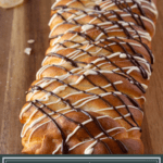 a loaf of braided yeast bread drizzled with white and dark chocolate