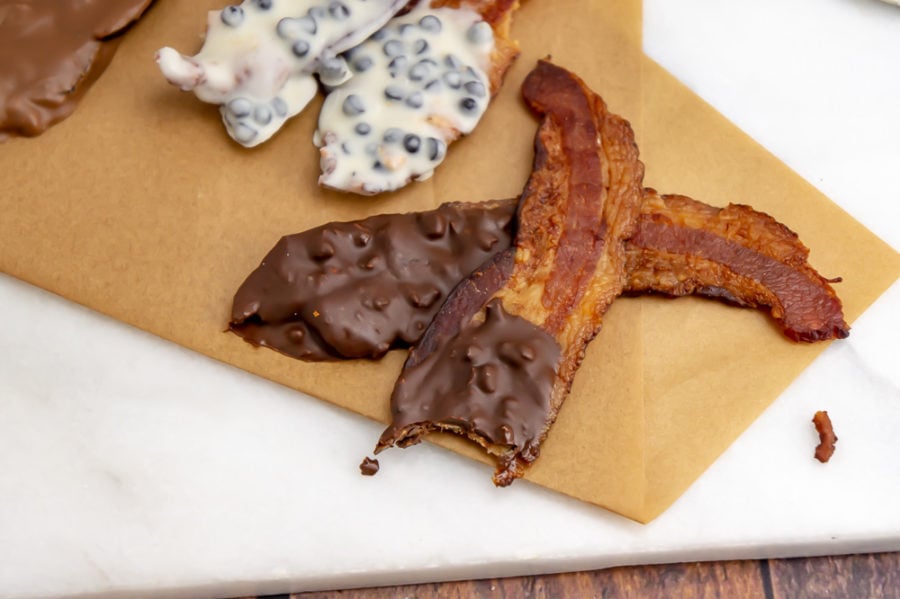 bacon coated in chocolate with a bite taken out of it