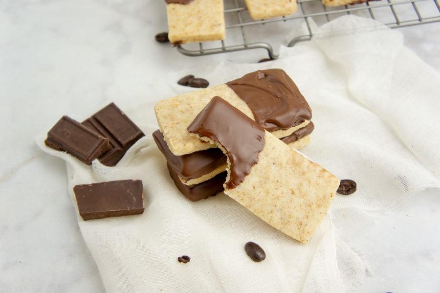 cookies stacked with one bite taken from the top one