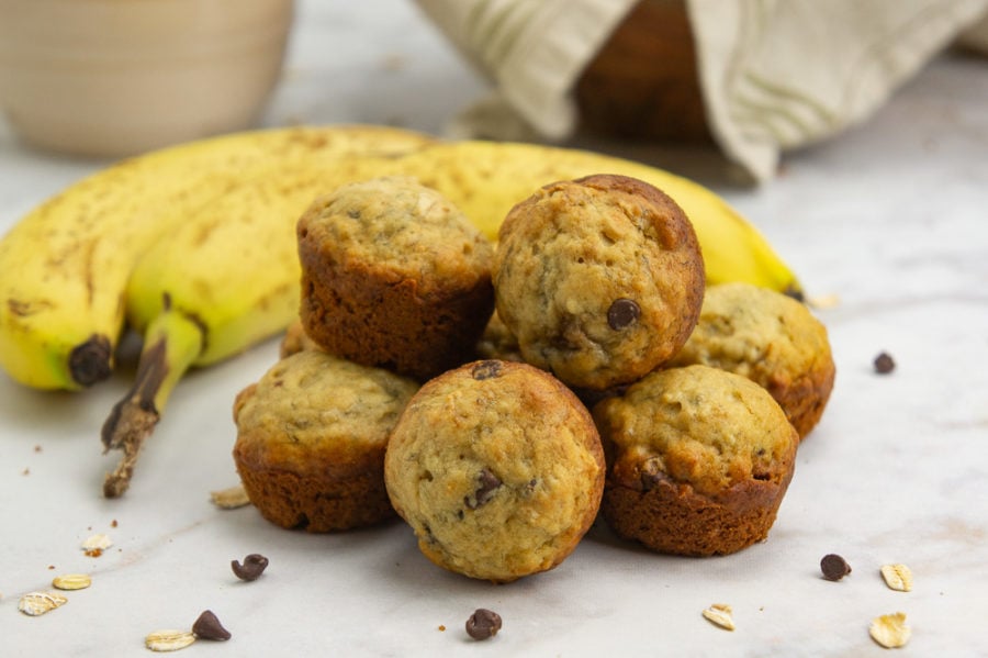 a pile of mini banana chocolate chip oatmeal muffins