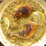 a pan of chicken braised with lemon and artichokes