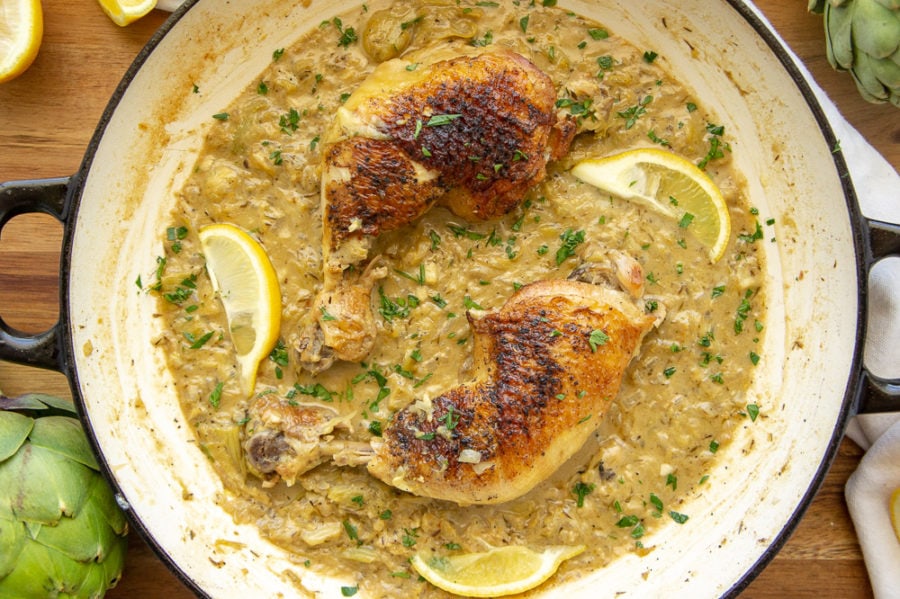 a pan of chicken braised with lemon and artichokes