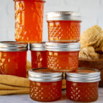 jars of jelly on a yellow linen
