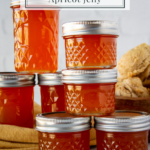 jars of apricot jelly stacked on a table