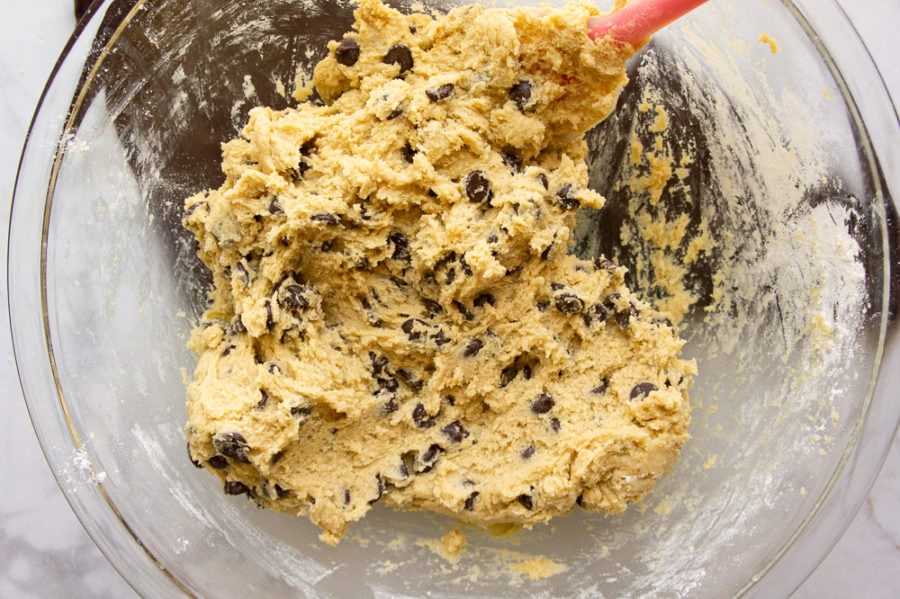 a bowl of dough with chocolate chips