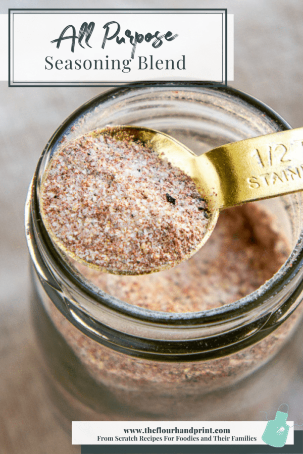 A jar of all purpose seasoning with a spoon