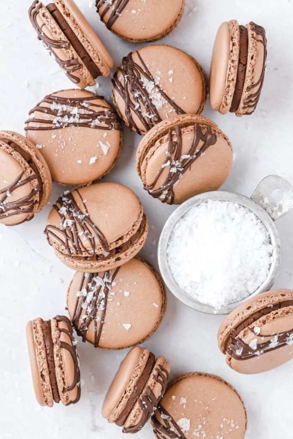 chocolate macarons scattered on a table