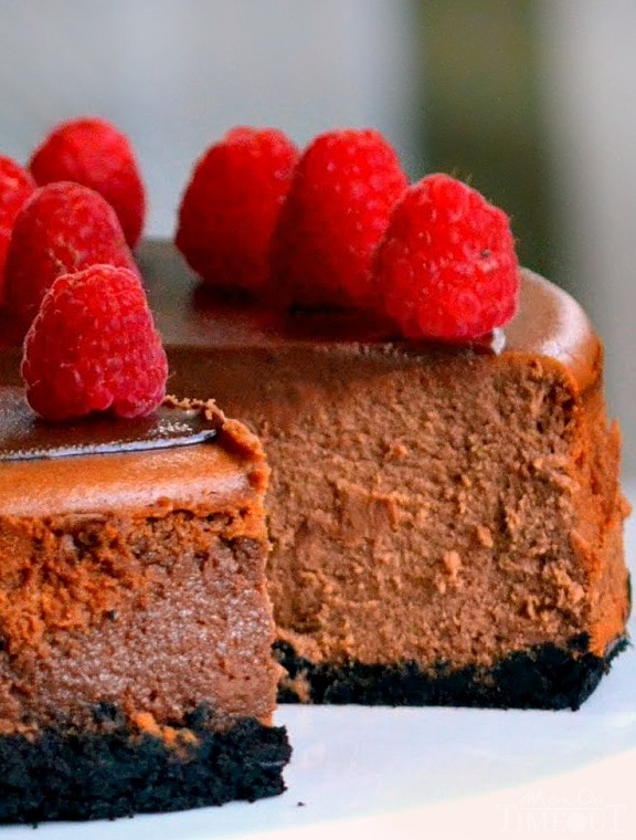 triple chocolate cheesecake with raspberries on top