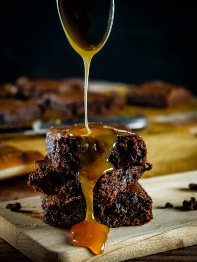 brownies stacked and drizzled with caramel