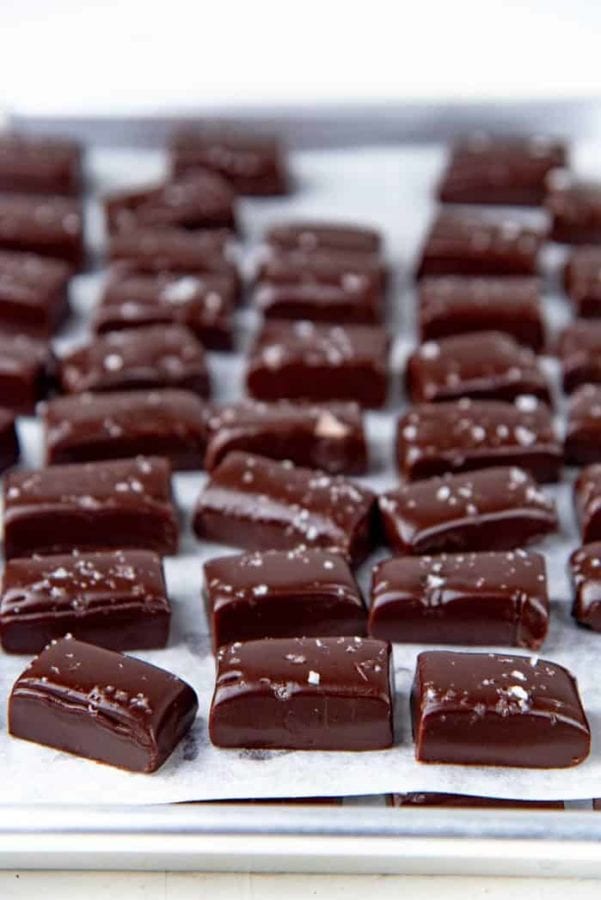 chocolate caramels on white parchment