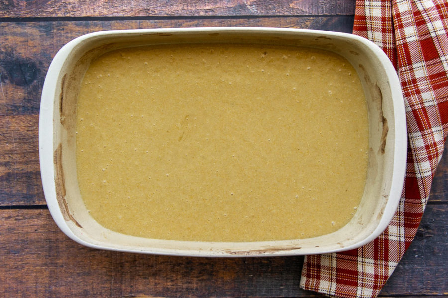a pan of unbaked homemade honey cornbread