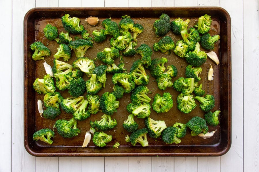 garlic and broccoli on a sheet pan