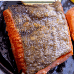 crispy skinned salmon in a pan