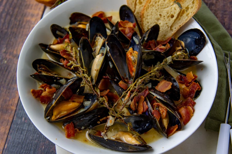 a bowl of mussels in cider cream sauce