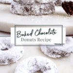 chocolate baked donuts rolled in powdered sugar