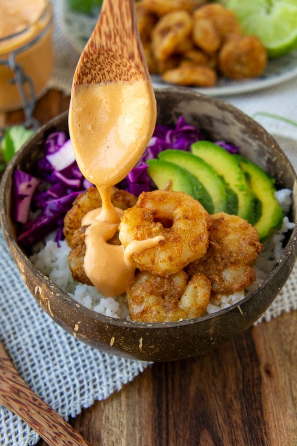 shrimp rice bowls with chipotle sauce drizzled on top