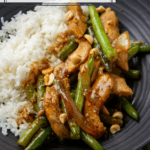 chicken strips and green beans in a sauce served with rice
