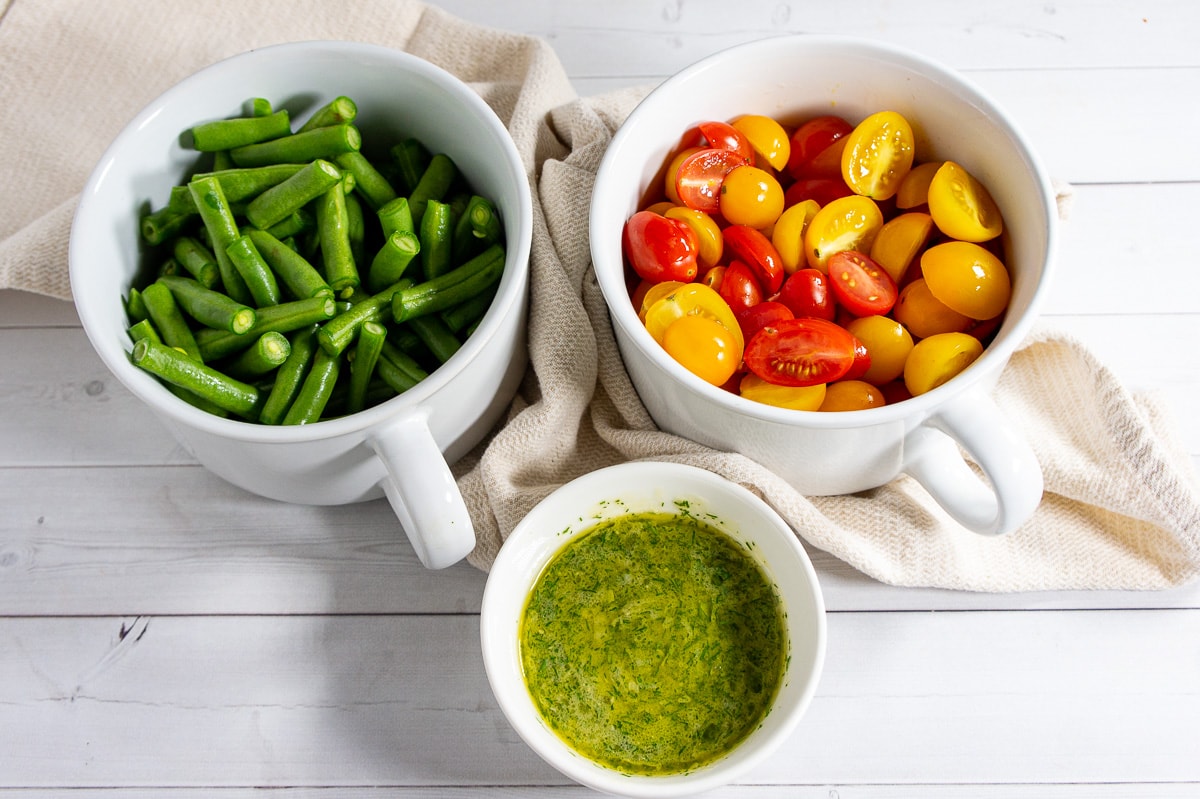 Ingredients to make a green bean and tomato salad