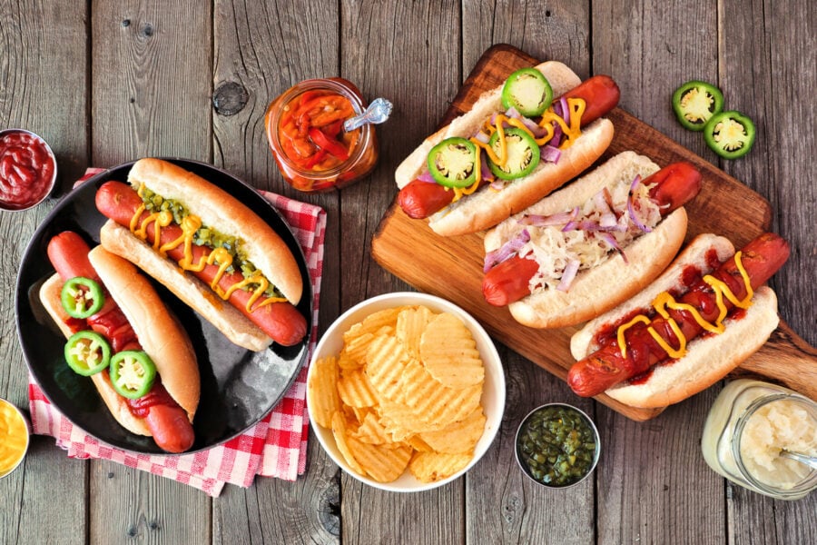 5 different hot dog combinations assembled.