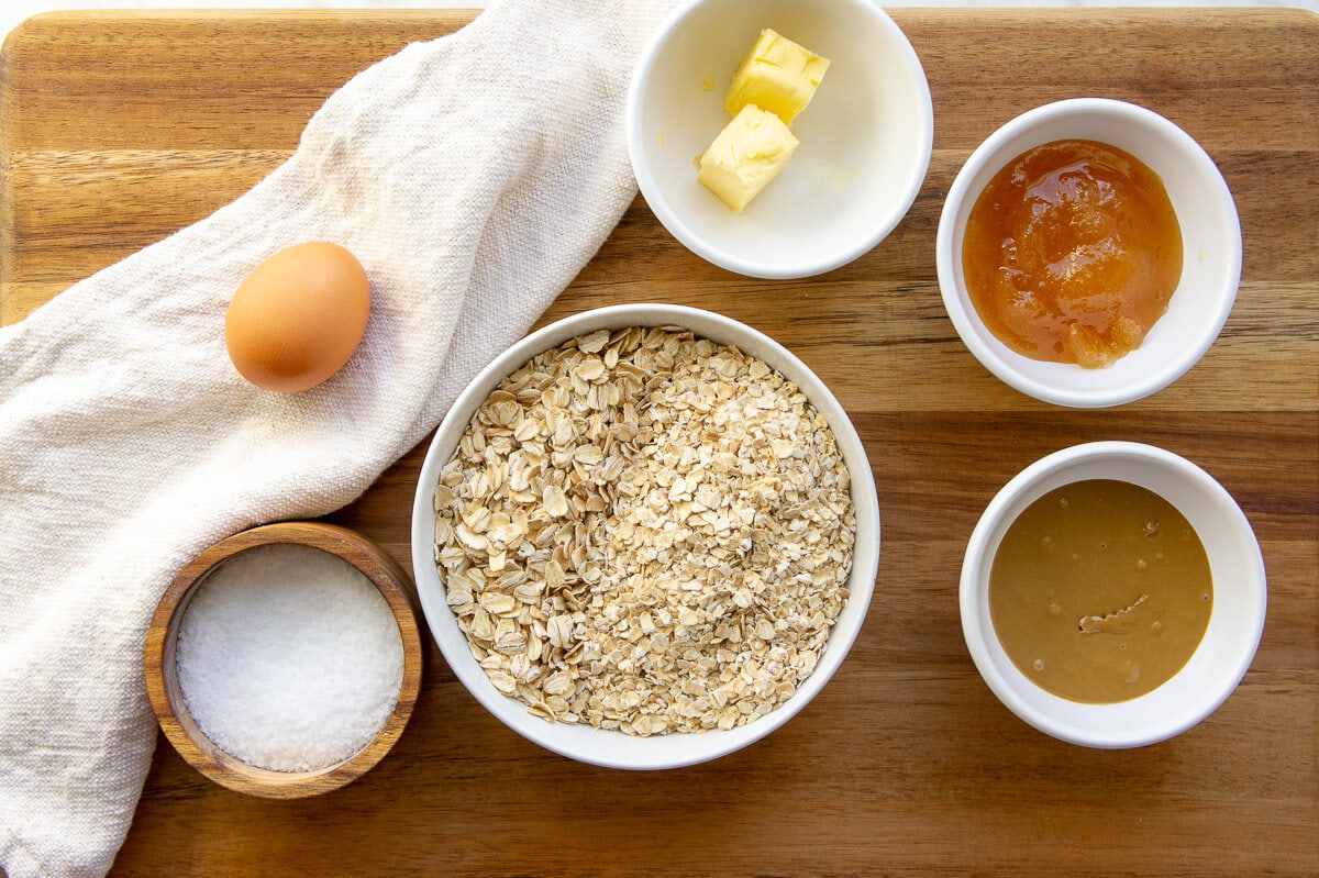 ingredients for nut-free granola bars including oats, honey, sunflower seed butter, and egg.