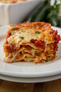 a slice of zucchini lasagna with layers of pasta and cheese.