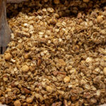 granola with cinnamon and nuts that's been baked.